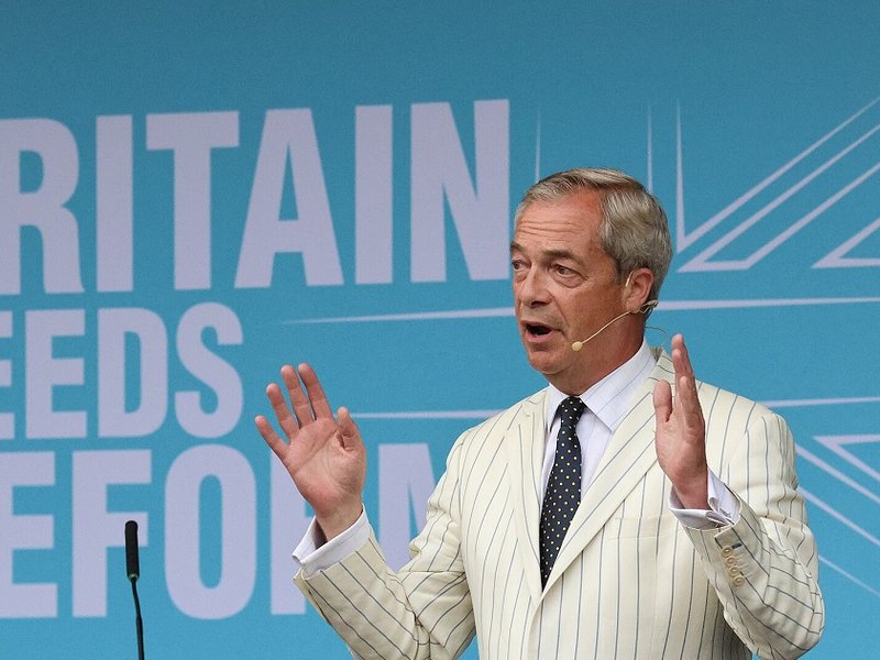 Nigel Farage speaking at a Reform UK event.