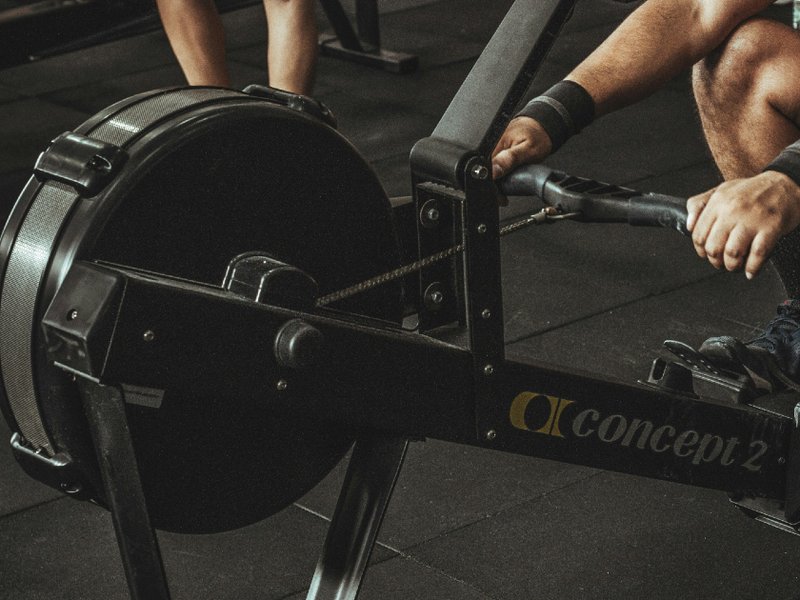 An image of a man using a gym machine.