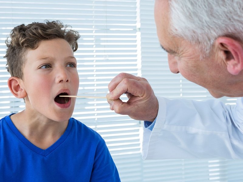 pikwizard-doctor-examining-patients-mouth.jpg