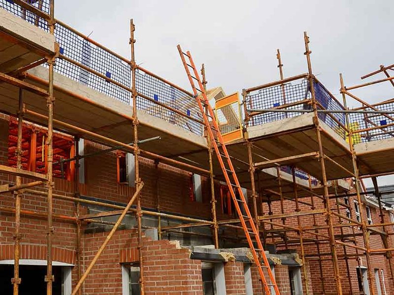 scaffolding-for-house-building-under-theresa-ma.jpg